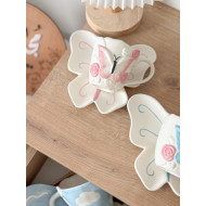 فنجان مع صحن شكل فراشة