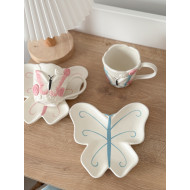 فنجان مع صحن شكل فراشة