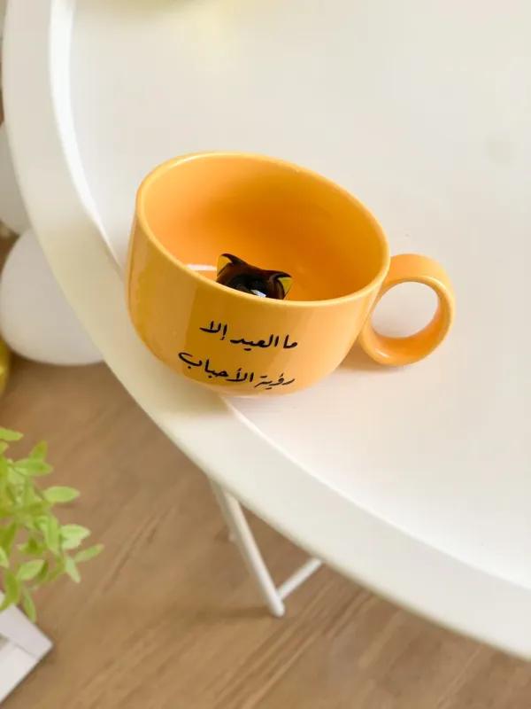 كوب العيد داخله قطة-رؤية الأحباب