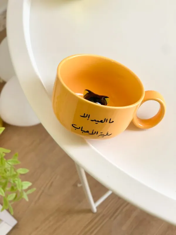 كوب العيد داخله قطة-رؤية الأحباب