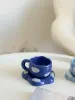 فنجان حجم صغير مع طباعة غيوم