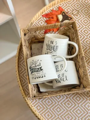 كوب أبيض مع عبارات