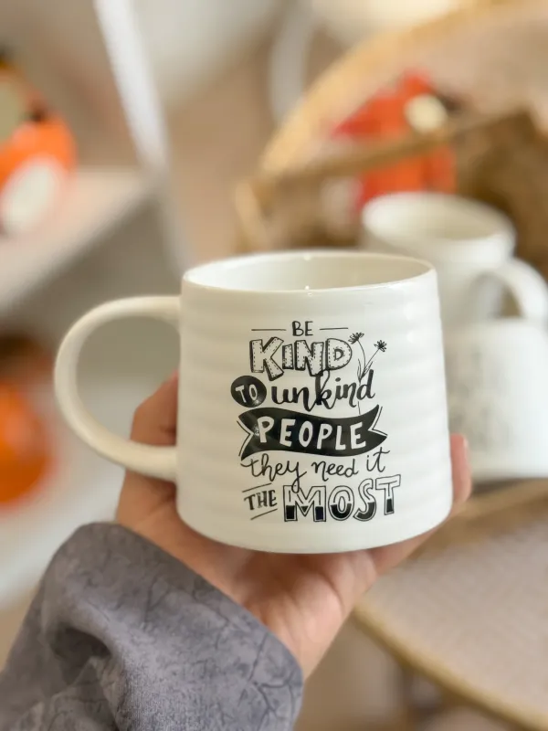كوب أبيض مع عبارات